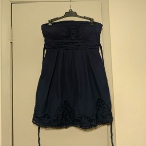 Navy strapless dress with bow in the back